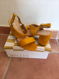SANDALIAS MOSTAZA
